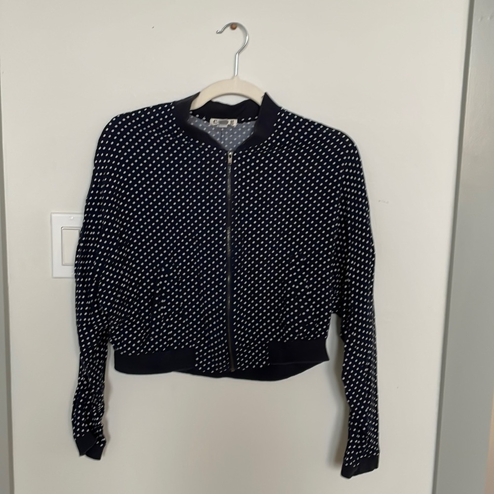 Waist length polka dot zip up.